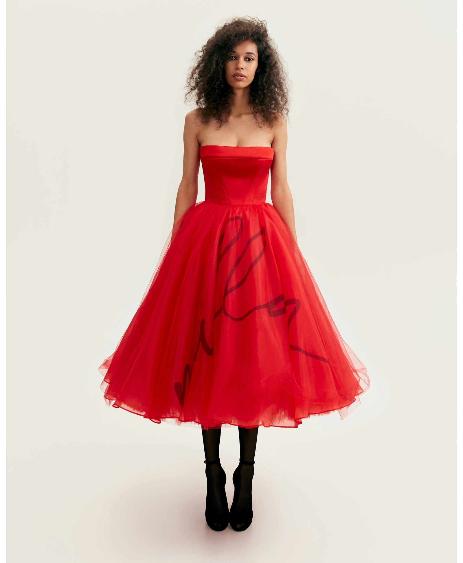 Dramatic red organza dress adorned with Milla's signature and black gloves, Xo Xo made by Milla
