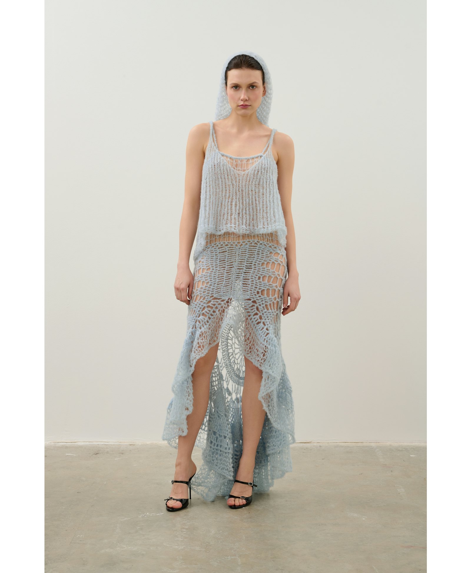 Handmade crochet dress in a shade of blue made by Karen Arcanjo