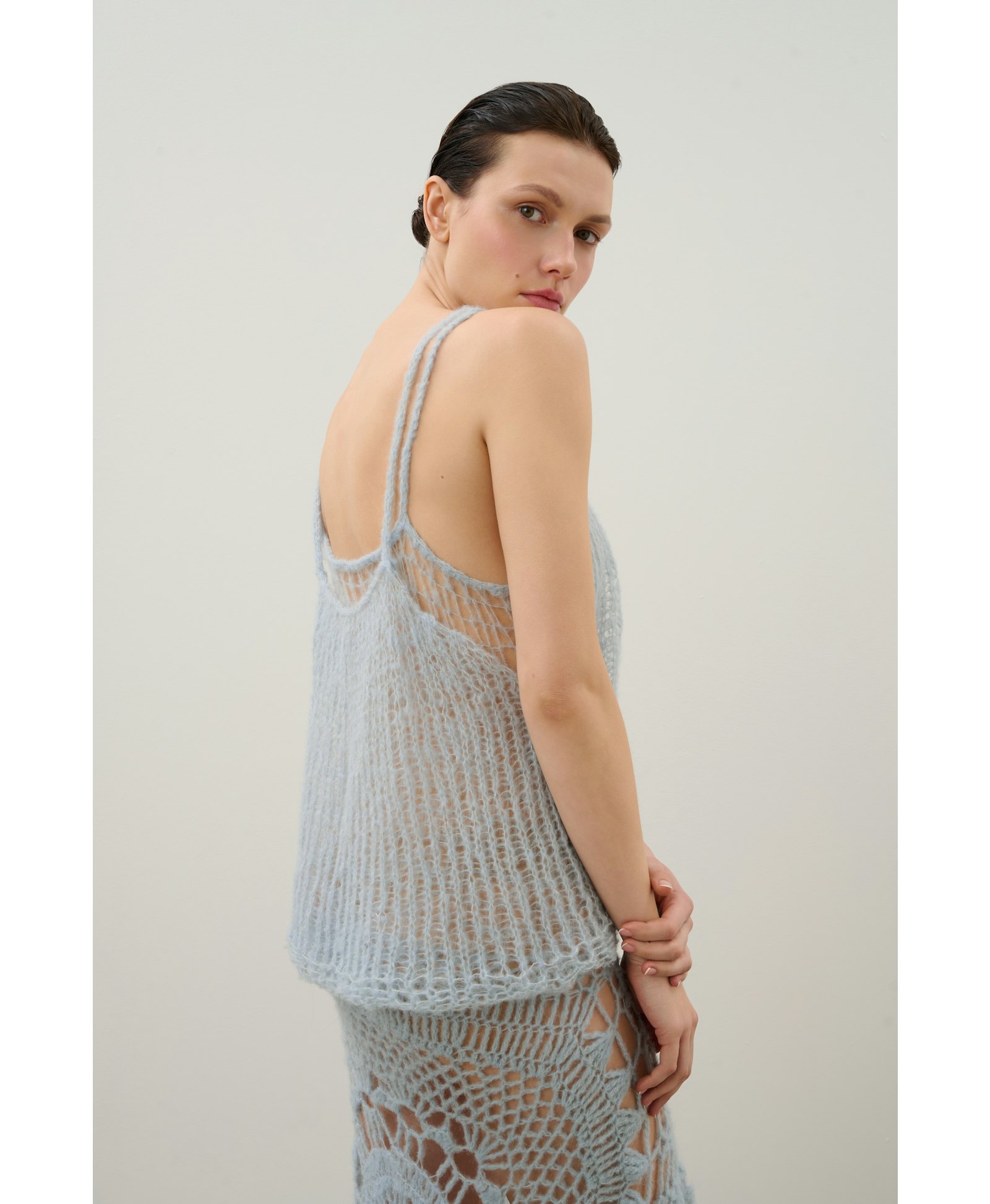 Handmade crochet dress in a shade of blue made by Karen Arcanjo