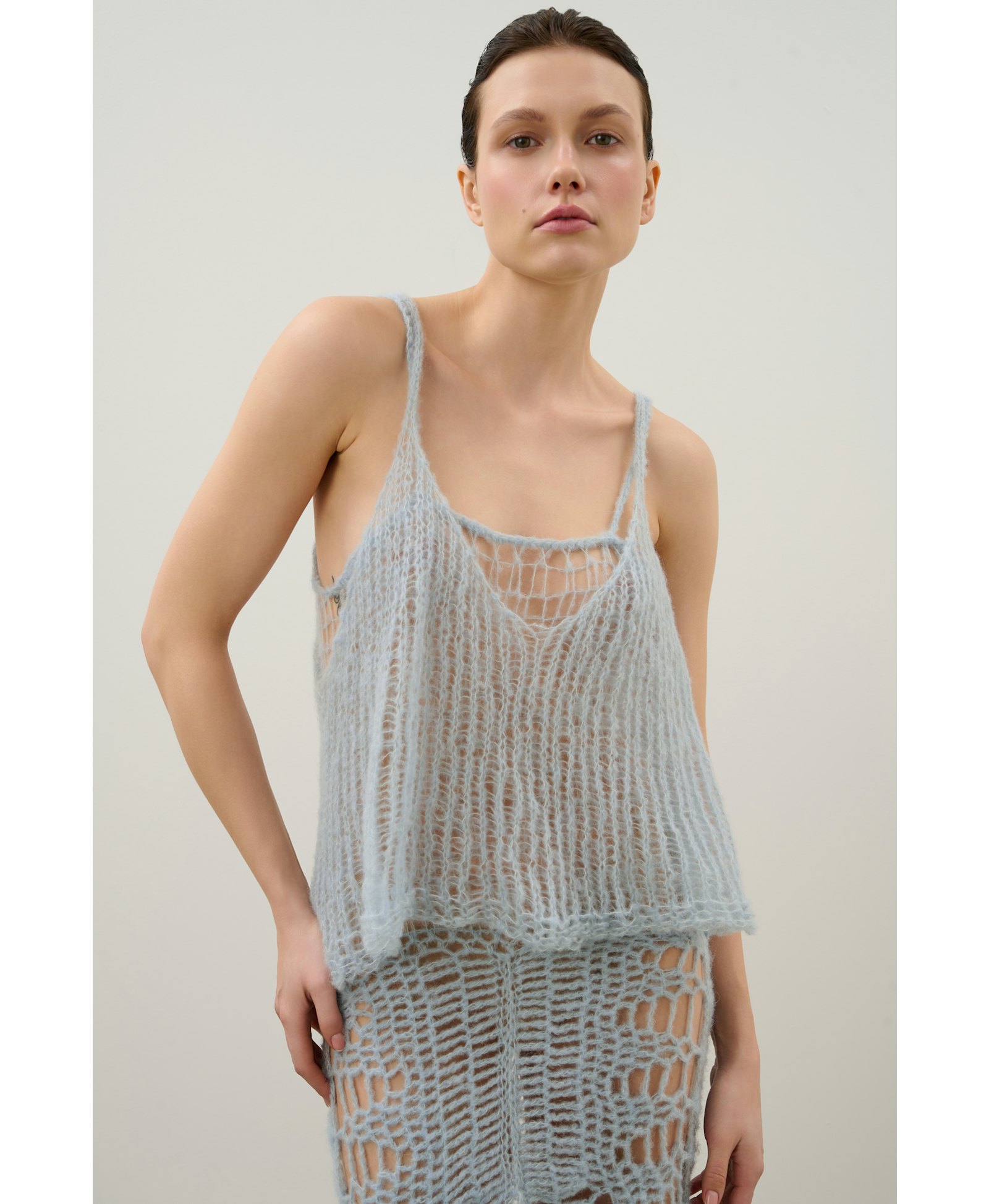 Handmade crochet dress in a shade of blue made by Karen Arcanjo