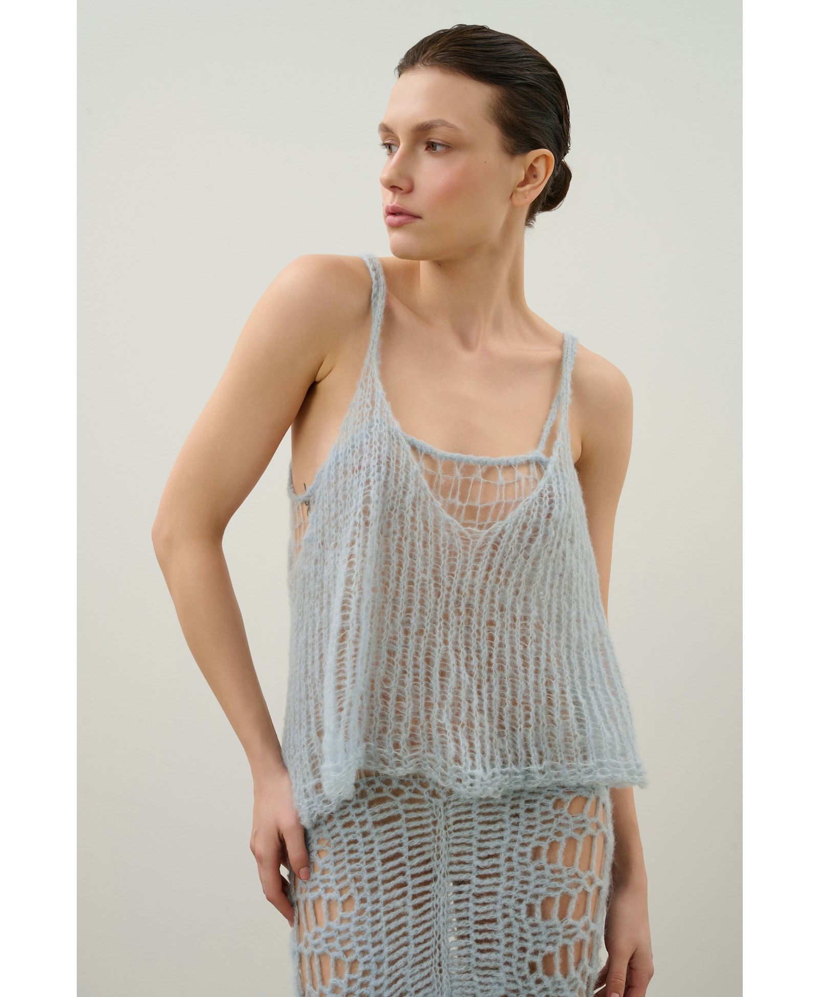 Handmade crochet dress in a shade of blue made by Karen Arcanjo