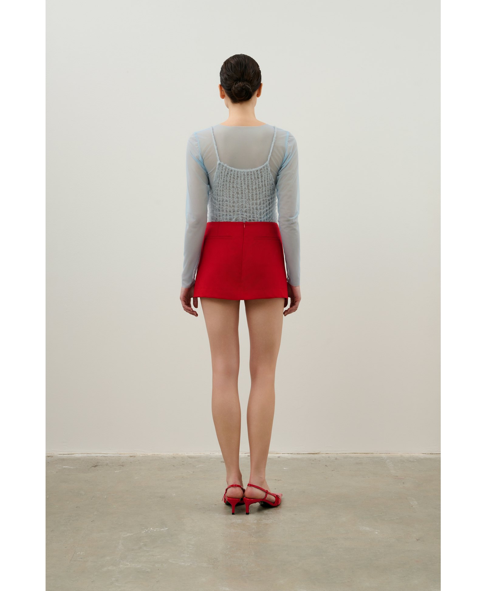Skirt and shorts made of red wool made by Karen Arcanjo