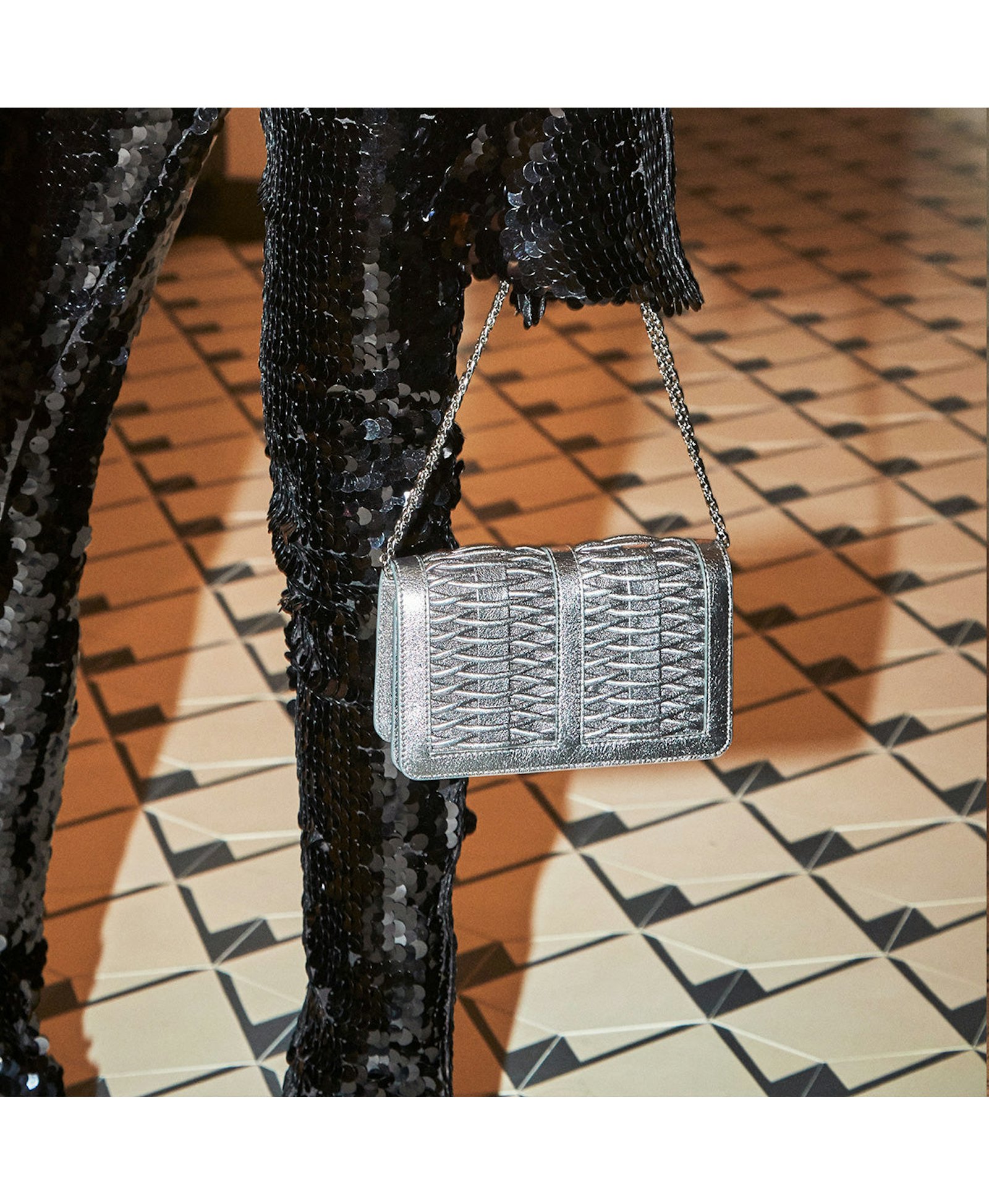 Lea pewter metallic braided clutch made by Yliana Yepez