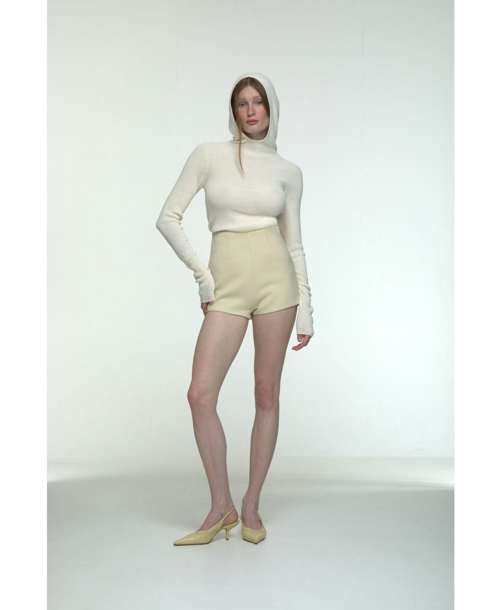 Hooded ribbed top in White made by AFTERHOURS