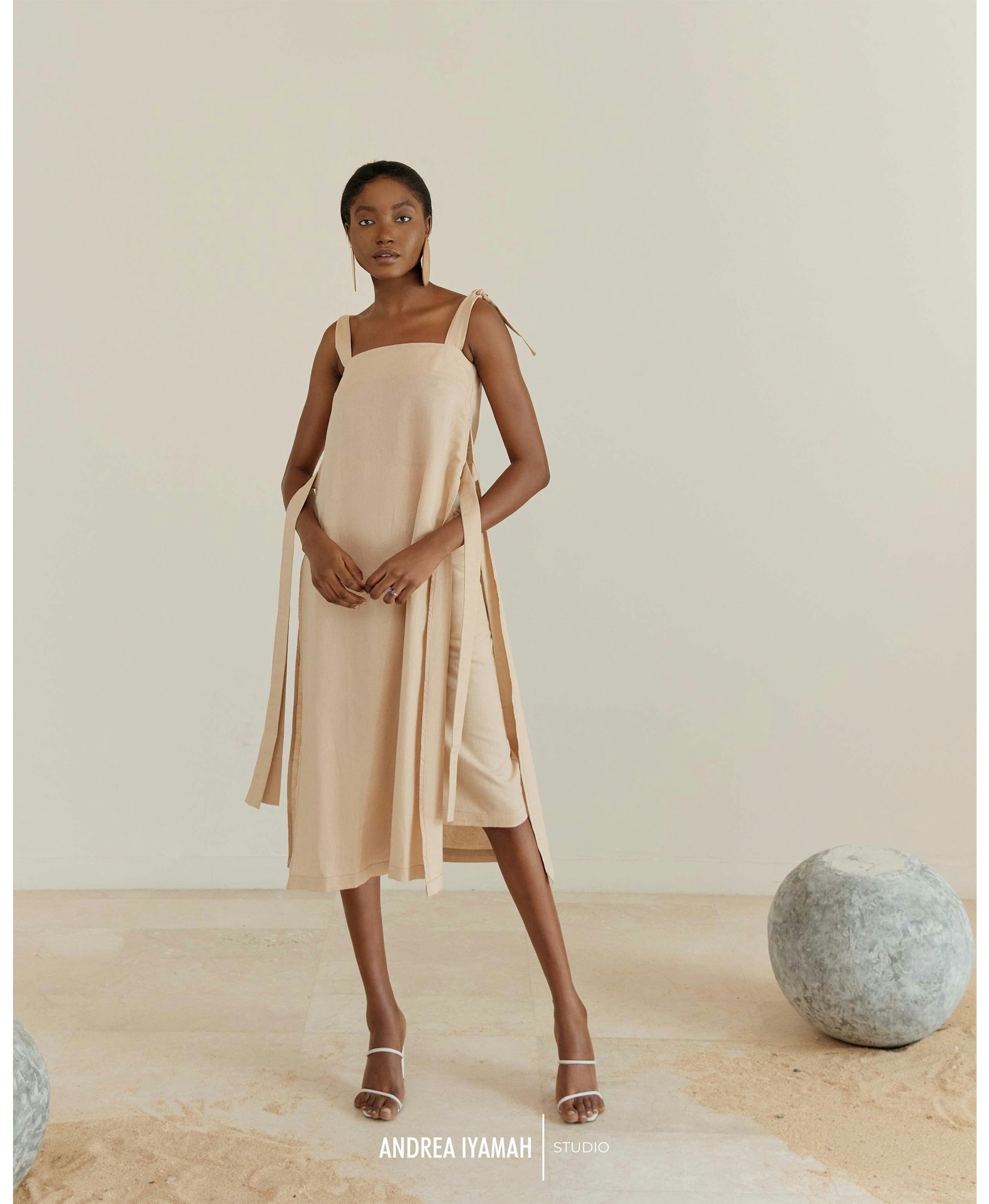 AFO CREAM MIDI SKIRT made by Andrea Iyamah