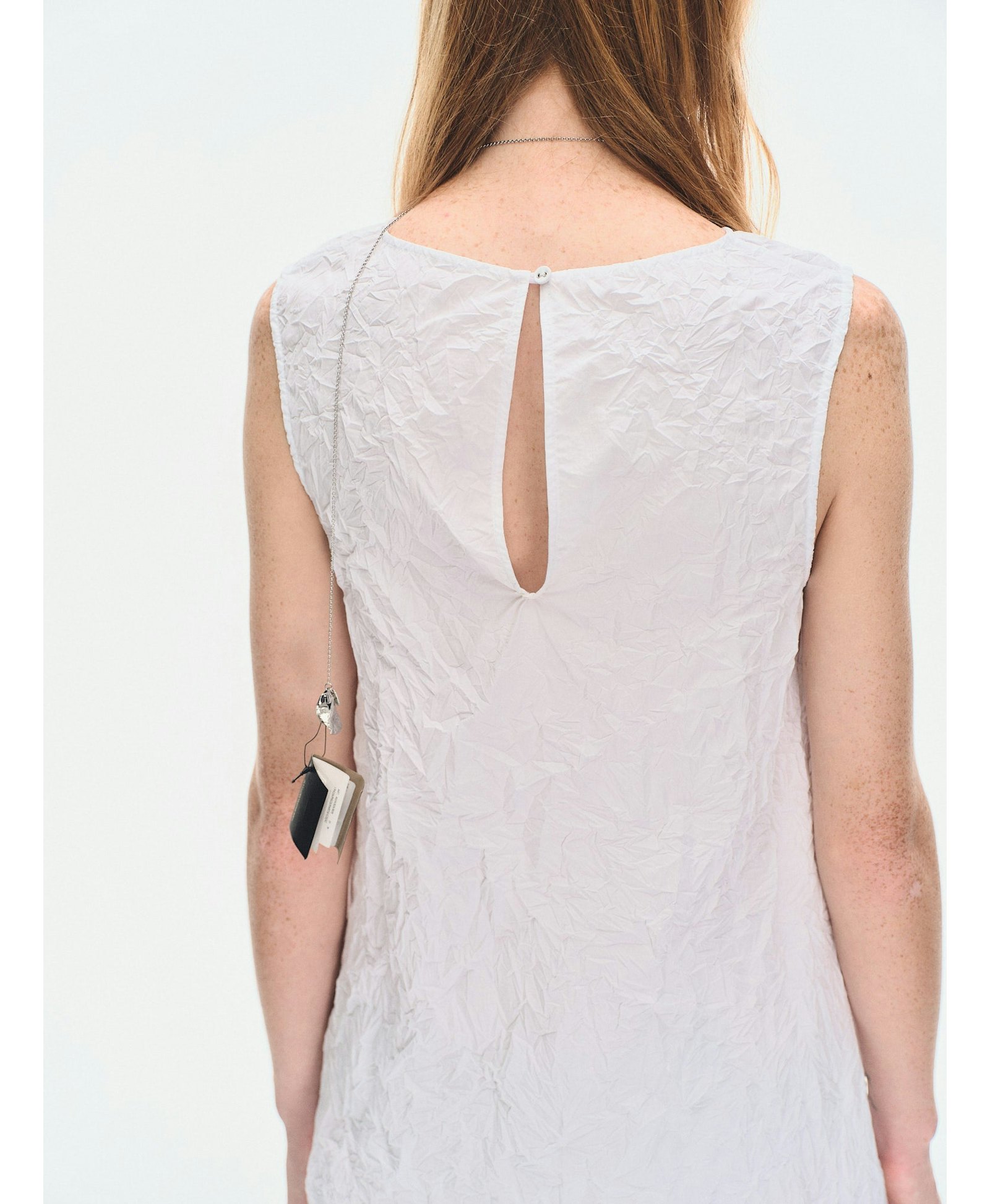 WHITE TEXTURED DRAPED MINI DRES made by YIBRI