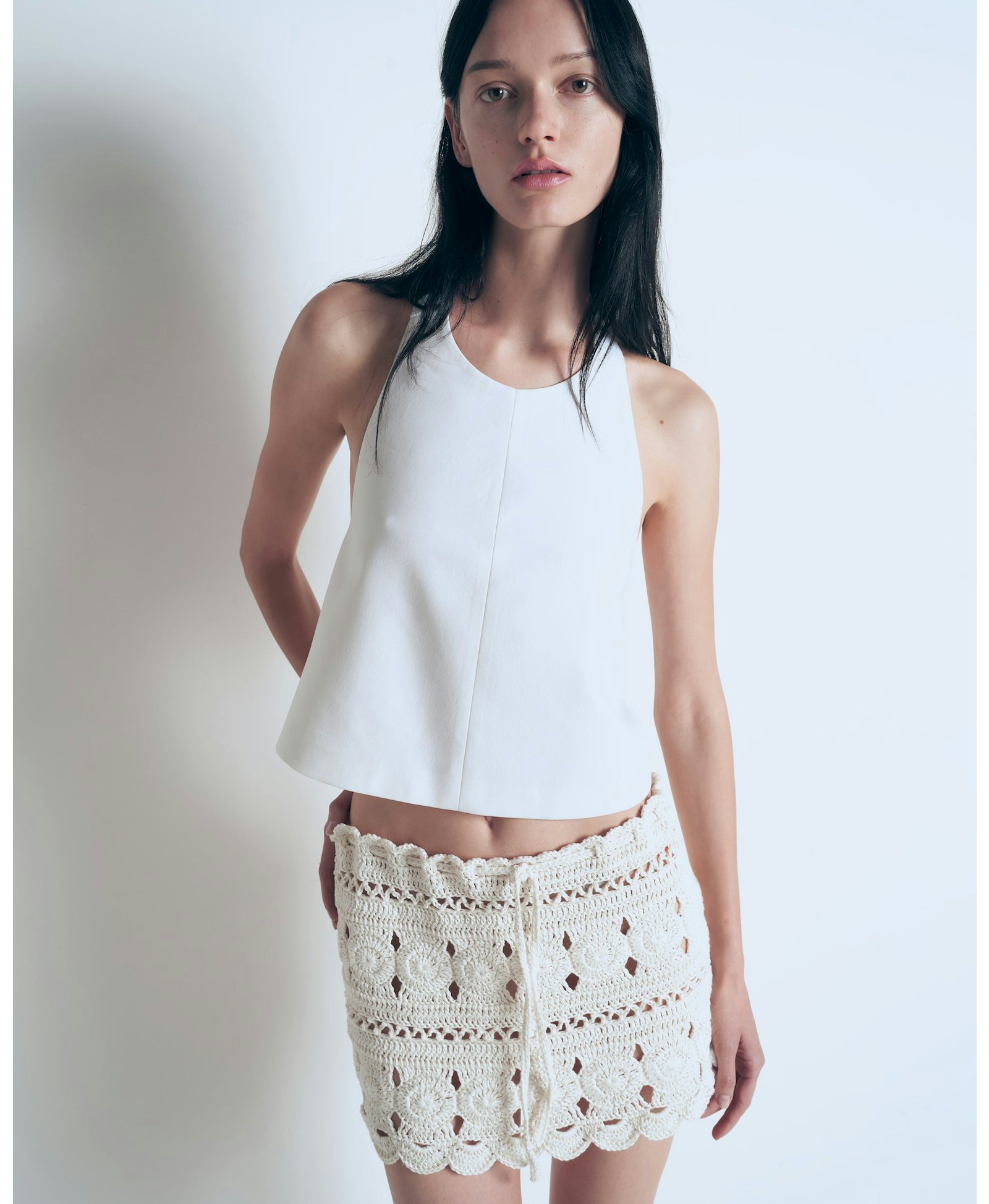 White tie top with buckle made by A.M.G