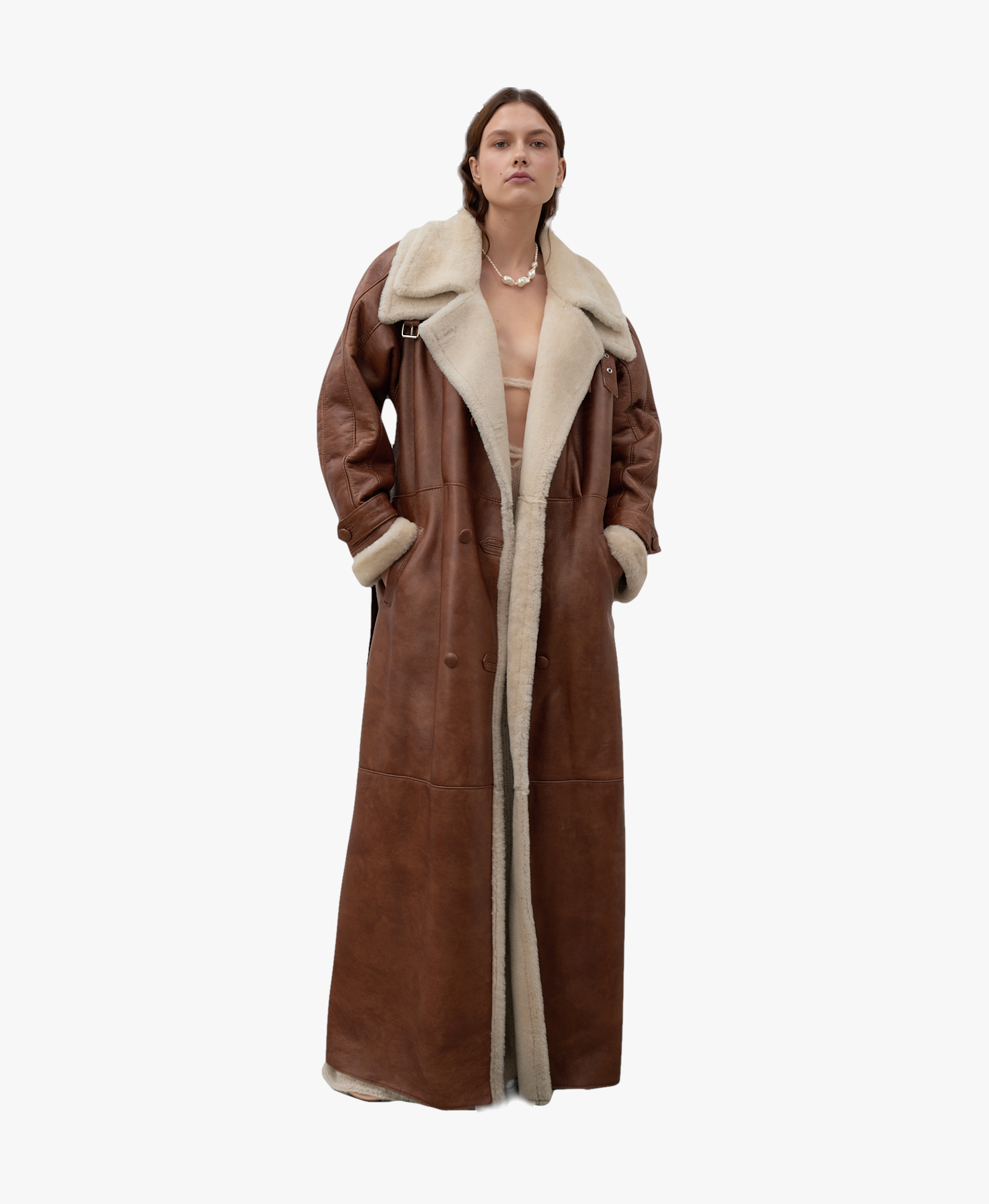 Long, caramel-colored sheepskin coat made by Karen Arcanjo