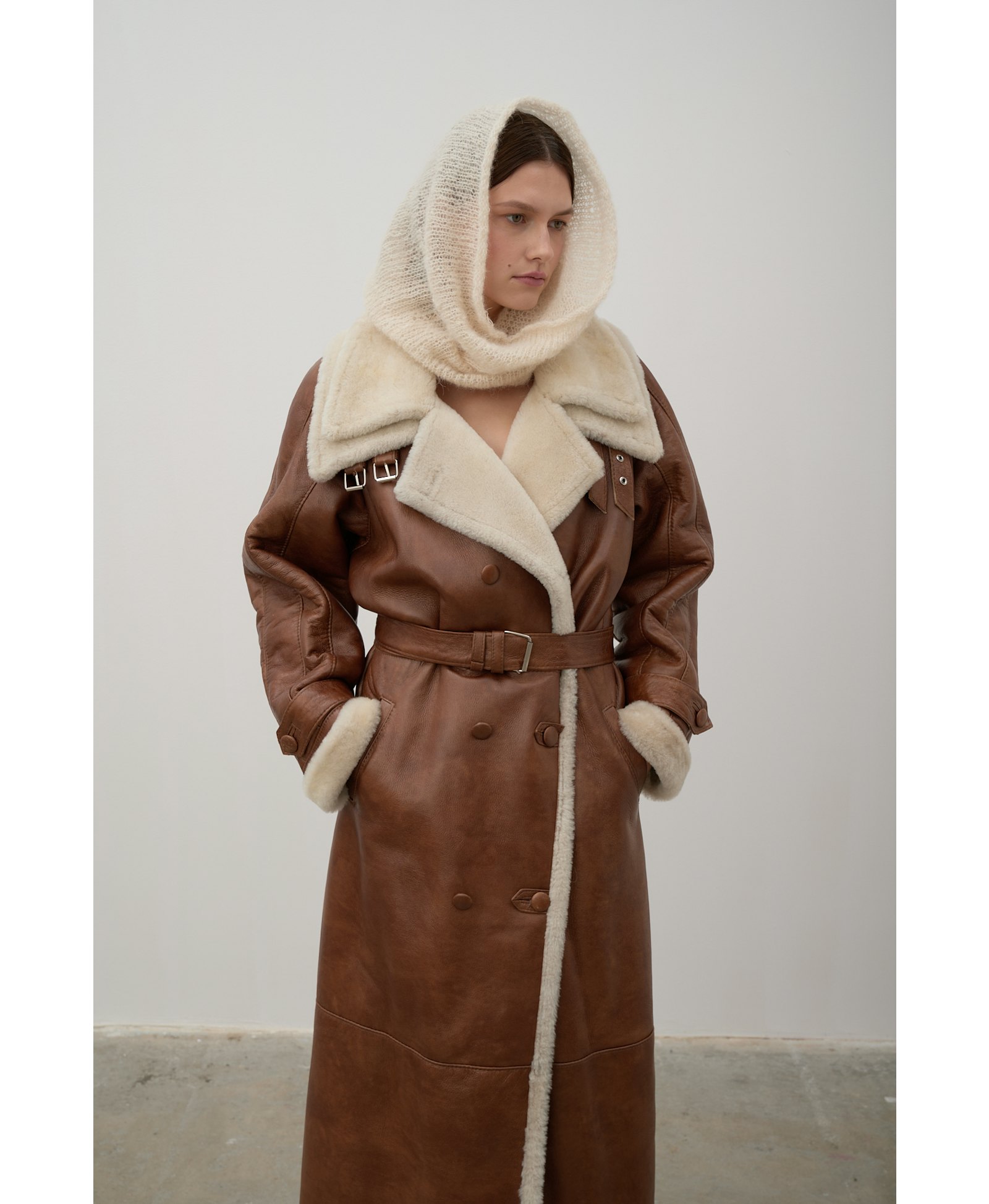 Long, caramel-colored sheepskin coat made by Karen Arcanjo