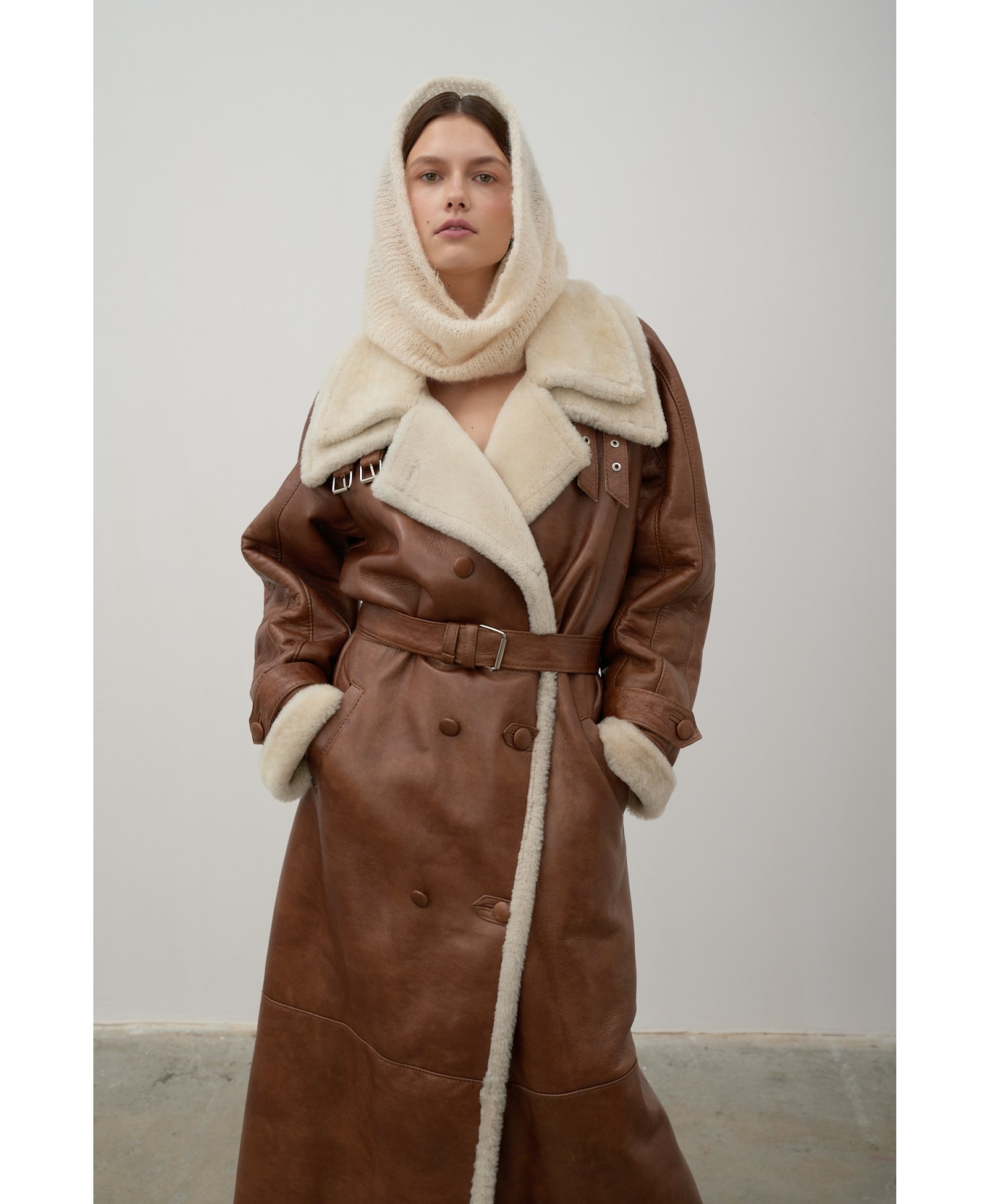 Long, caramel-colored sheepskin coat made by Karen Arcanjo