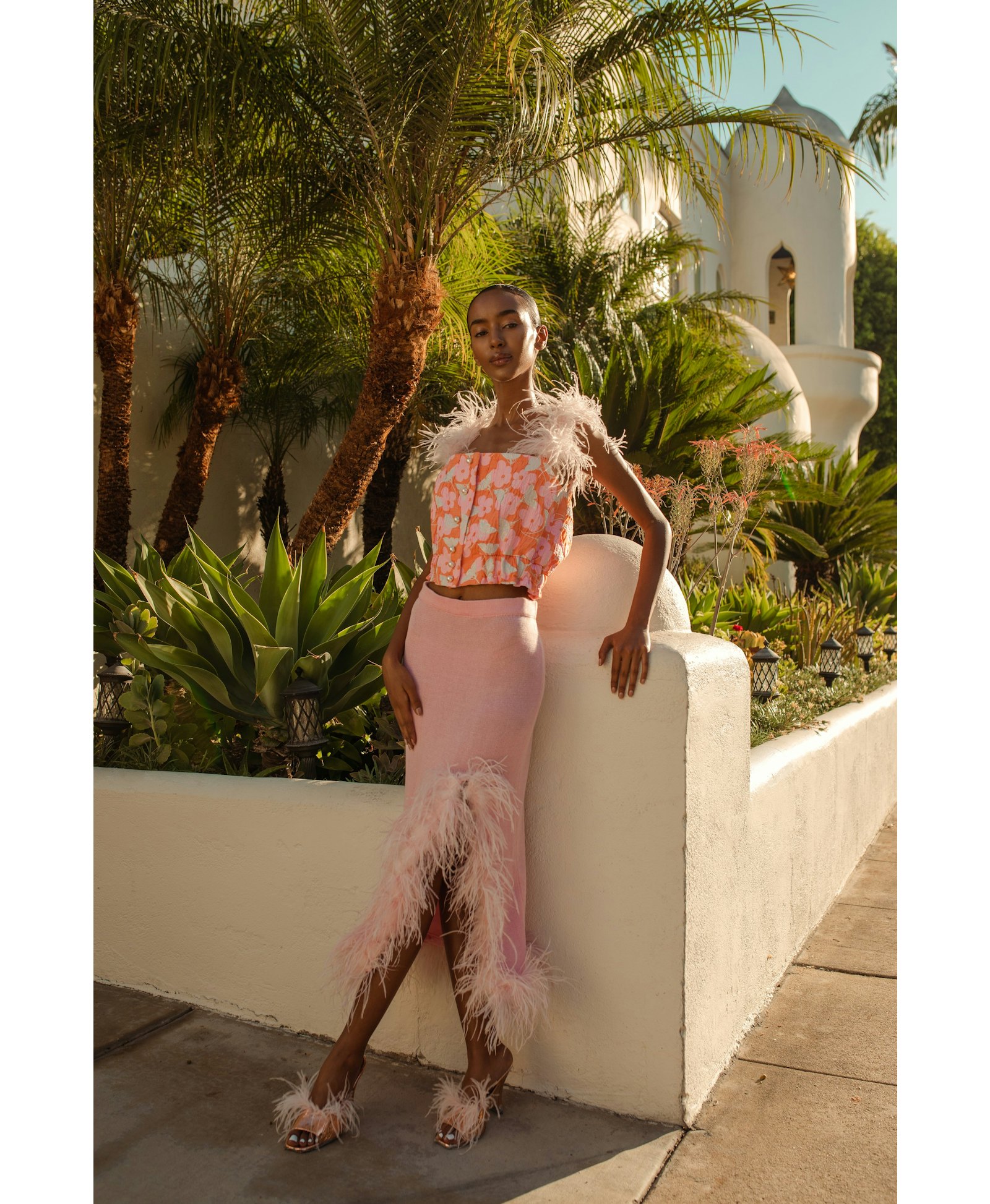 Pink flower top with feather details and pearl buttons in Pink made by ANDREEVA