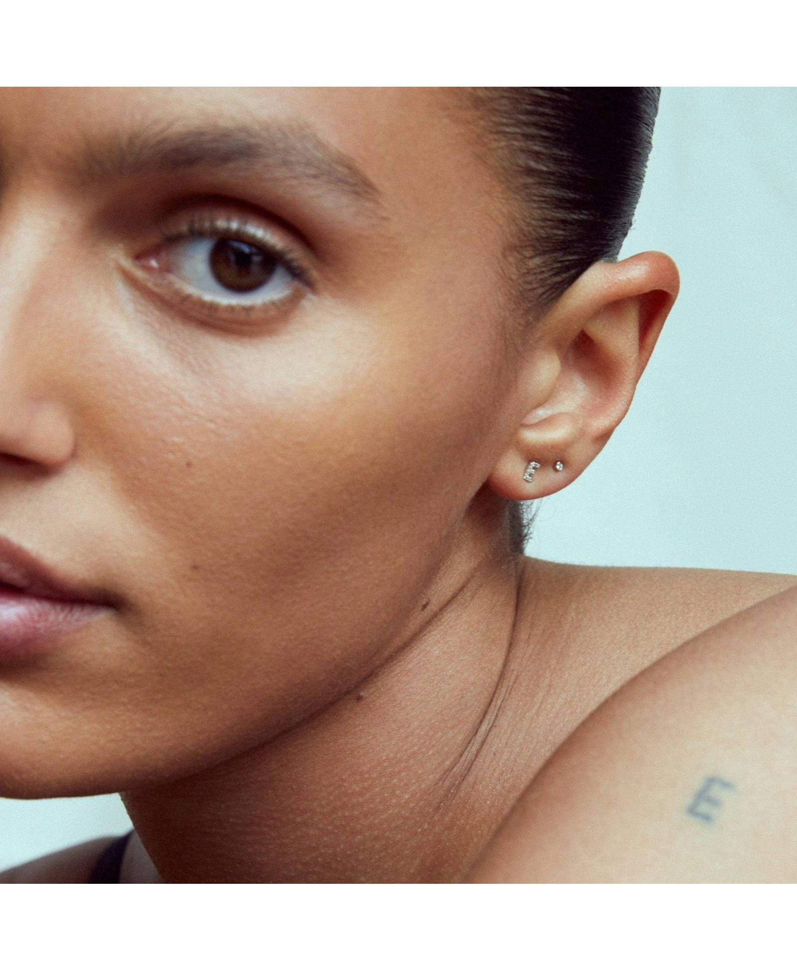 PETITE LETTER STUD - WHITE DIAMONDS & WHITE GOLD made by ENNUI